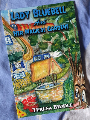 Lady Bluebell and Her Magical Gardens book cover showing very busy drawing of lady in a garden