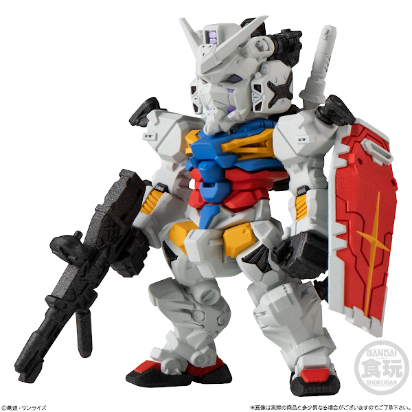 White robot figure with blue, red, and yellow torso, carrying a rifle and shield.