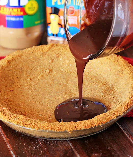 Pouring Chocolate Ganache into Crust to Make the Pie's Black Bottom Image