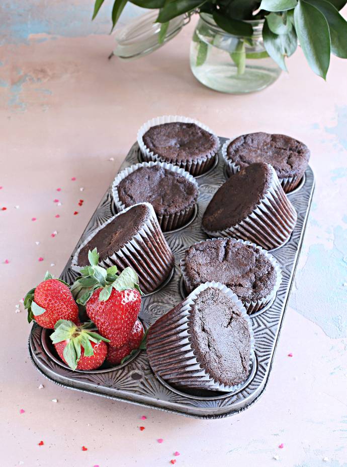 Recipe for tender chocolate cupcakes, filled and frosted with a strawberry cream cheese frosting.