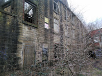 <img src="edenwood mill.jpeg" alt="derelict mill near edenfield lancashire, showing the entrance">