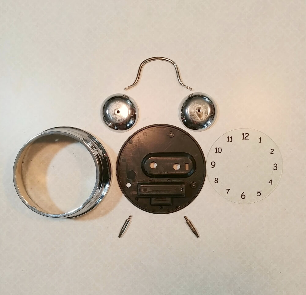 A Miniature Boho Scene in a Repurposed Alarm Clock
