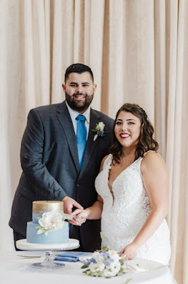 bride and groom cutting cake