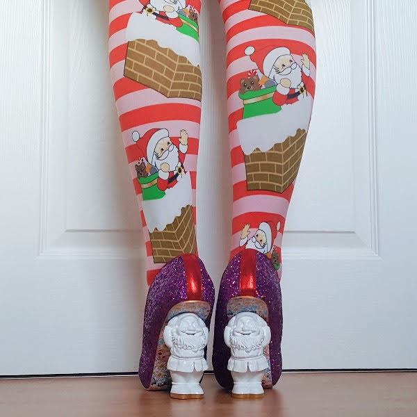 back of legs in Santa chimney tights with Santa heeled shoes