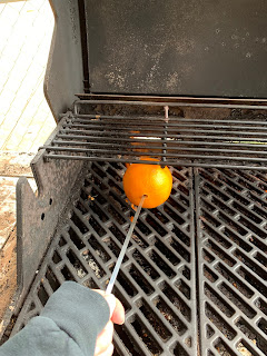 Charred the orange on an open flame.