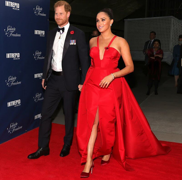 Meghan Markle wore a red gown by Carolina Herrera and shoes by Giuseppe Zanotti. Birks snowflake snowstorm diamond earrings
