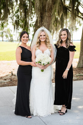 bride smiling with bridesmaids