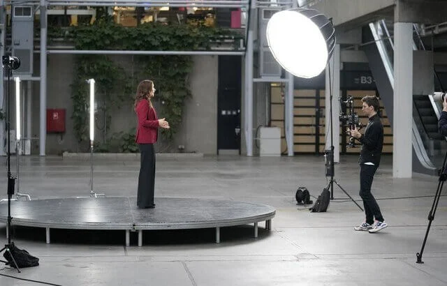 Crown Princess Mary wore a wine red crepe blazer by Alexander McQueen, and black wide leg trousers