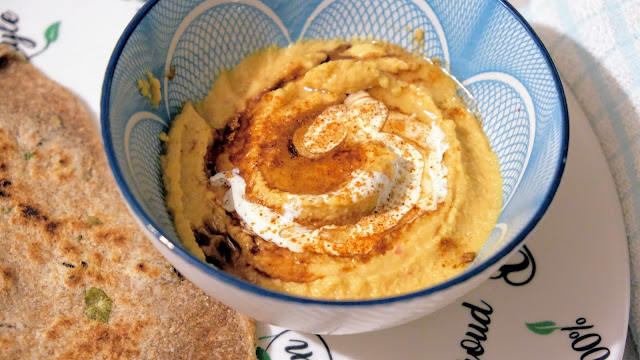 Hummus topped with balsamic vinegar and cream