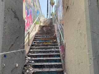 stairway strewn with litter