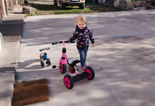 Rosie having fun with her bikes