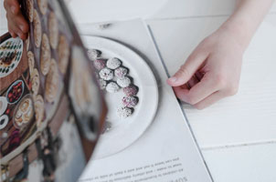 hand flipping through cookbook