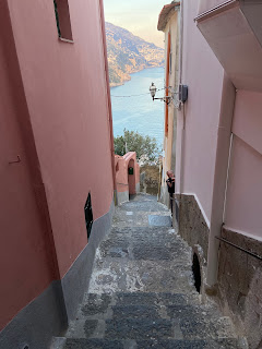 Stairs in Positano with view of the Mediterranean Sea.