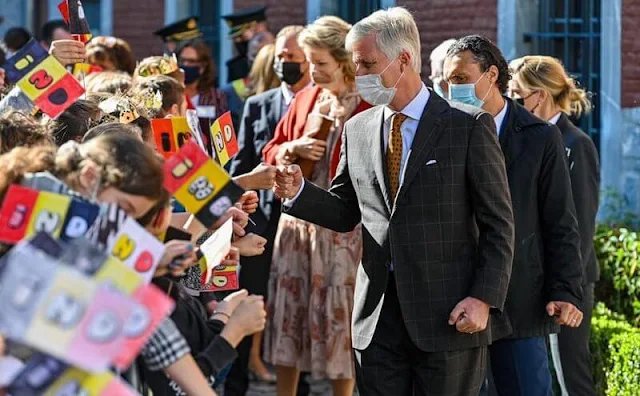 Queen Mathilde wore a floral print dress from Zimmermann. Mathilde wore a print dress from Etro. Natan floral dress