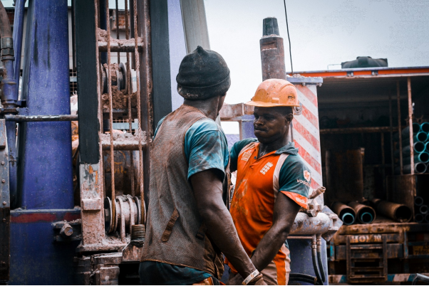 Men Working on Drilling Task