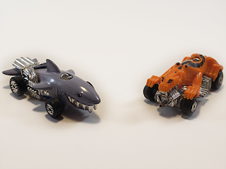 A couple of Hot Wheels speed demons. One is a shark, the other is a leopard or maybe a cheetah. I'm not a zoologist!