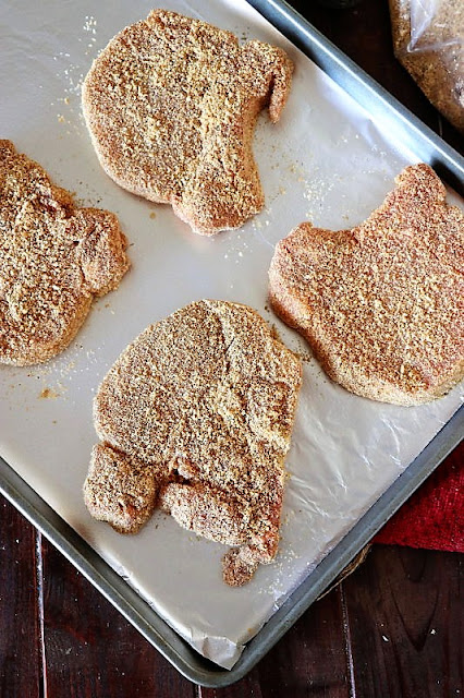 Coated Pork Chops On a Foil-Lined Baking Sheet Image