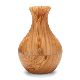 The ultra-quiet portable ultrasonic humidifier keeps your living space clean and properly moisturized Wood grain hown - store