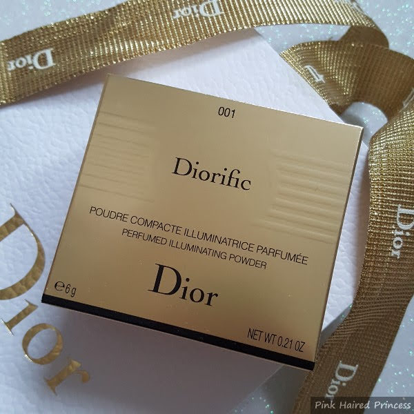 gold box with Dior Diorific Perfumed Illuminating Powder written on front