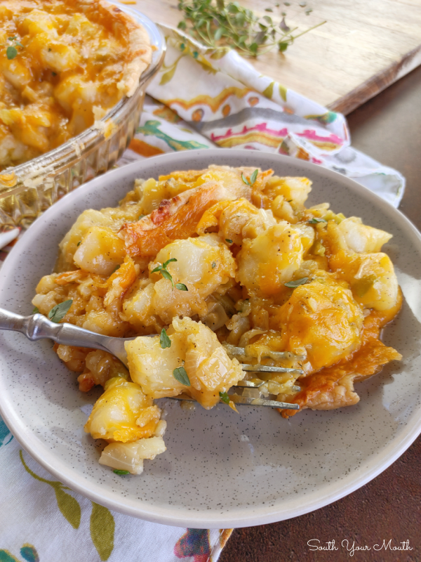 Homity Pie - A savory, flavor-packed English pie made with potatoes, onions, leeks and cream, topped with cheese often made in England during World War II amid ration restrictions.