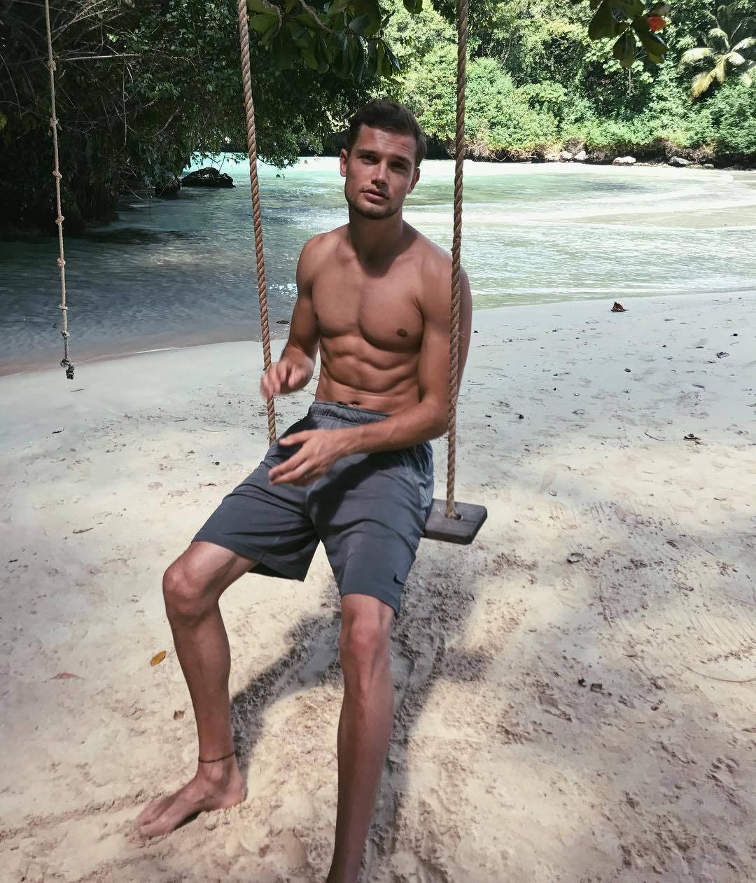 attractive-shirtless-fit-sexy-guy-abs-summer-vacation-beach-swing