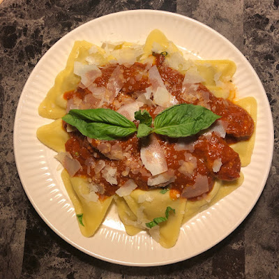 Porcini mushroom and truffle ravioli with Italian sausage marinara