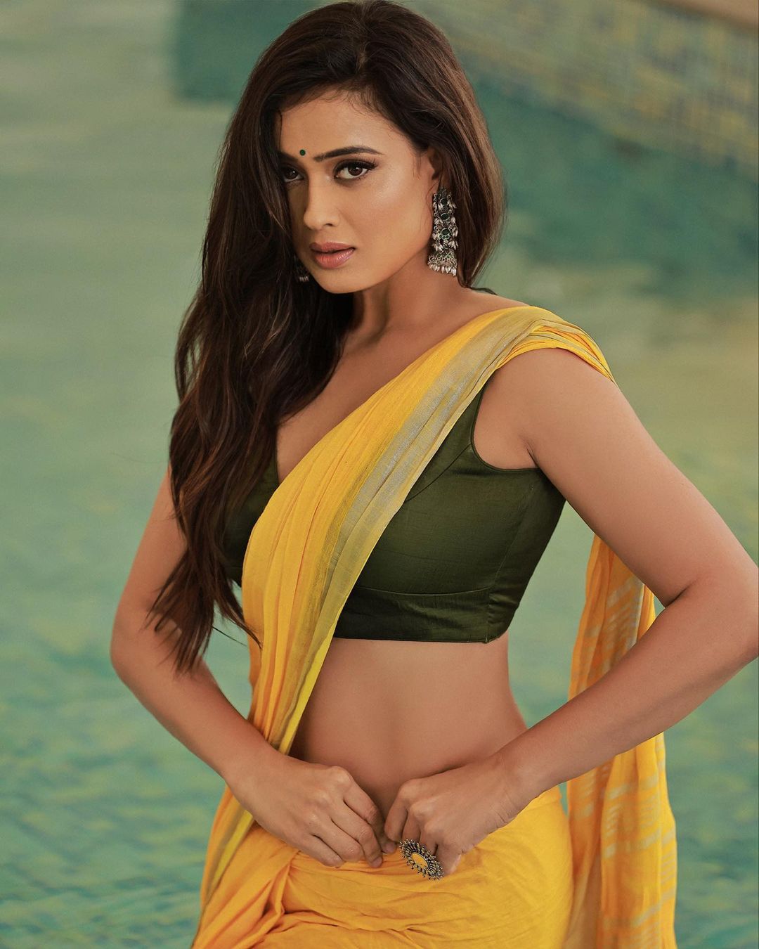 Shweta Tiwari flaunts her curves at 42 in a Yellow Saree and a Sleeveless Plunging Neckline Blouse (View Pics)