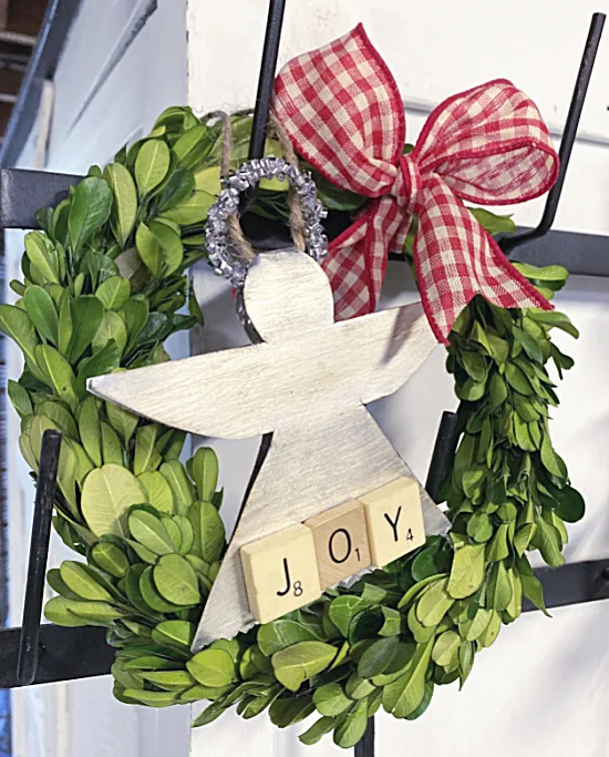 angel ornament on wreath with bow