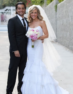 Rich Orosco with his wife Julie Benz in their wedding dress