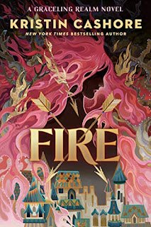 Pink flames riddled with golden arrows, a gold and teal town is visible between the flames.