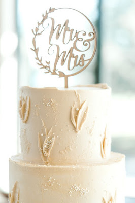 wedding cake with hearts and wedding topper