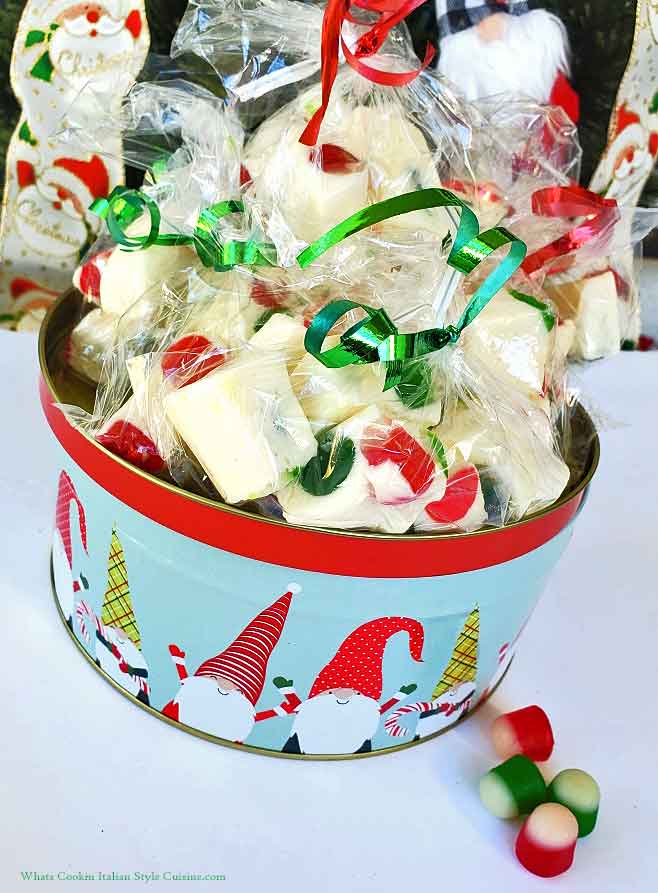 packing nougat for Christmas in holiday tins with dot candy