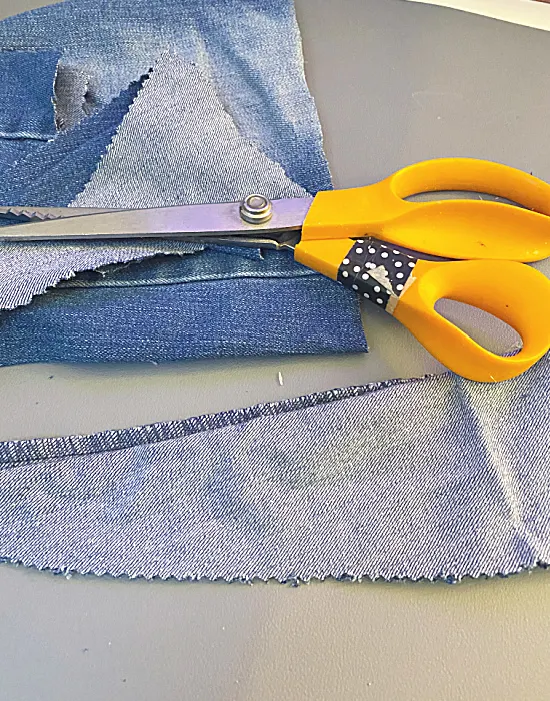 denim being cut into triangles