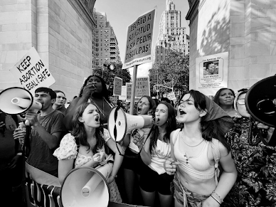 black and white photograph of thousands of abortion rights supporters rallying in Washington Square Park hours after the Supreme Court overturned Roe v. Wade on June 28.