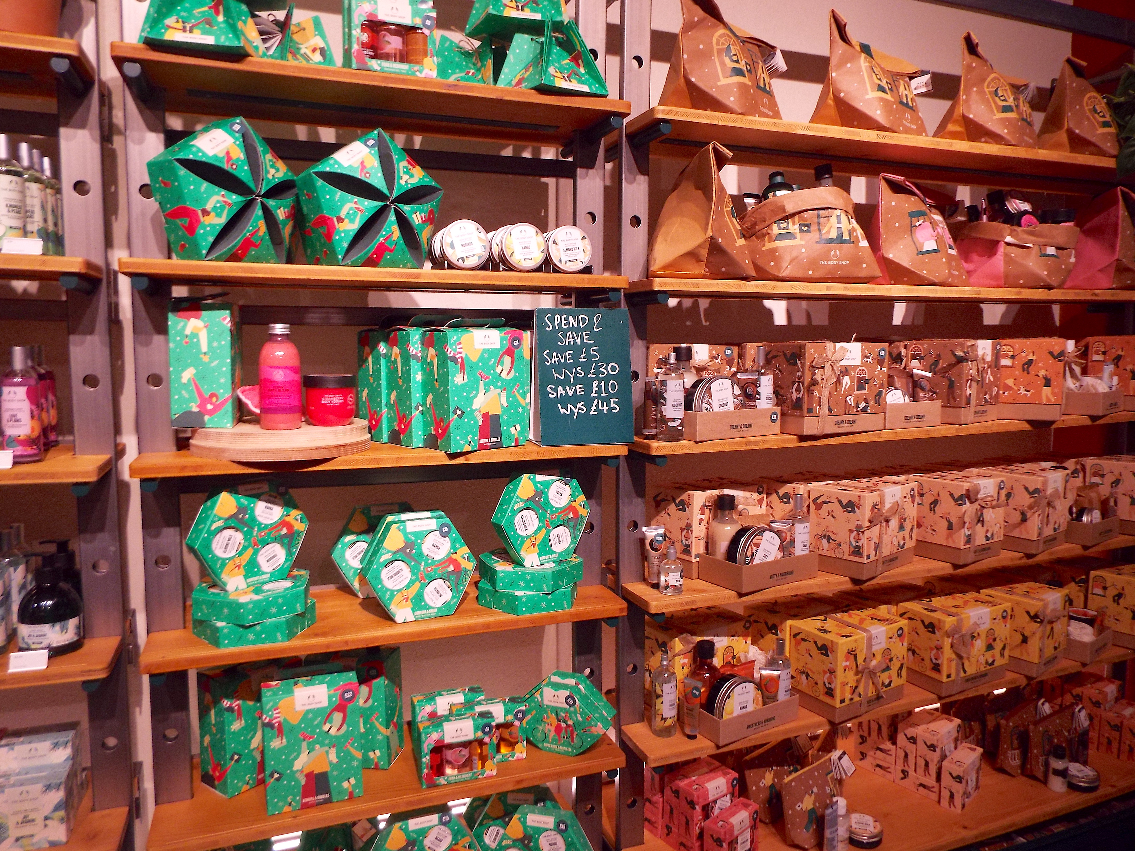 A bight, warm-toned wall of the colourful Christmas gift sets.