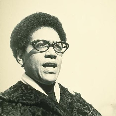 Black and white photo of Audre Lorde.