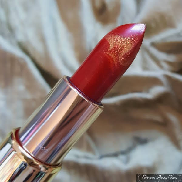 close up of limited edition gold and red marbled Givenchy lipstick