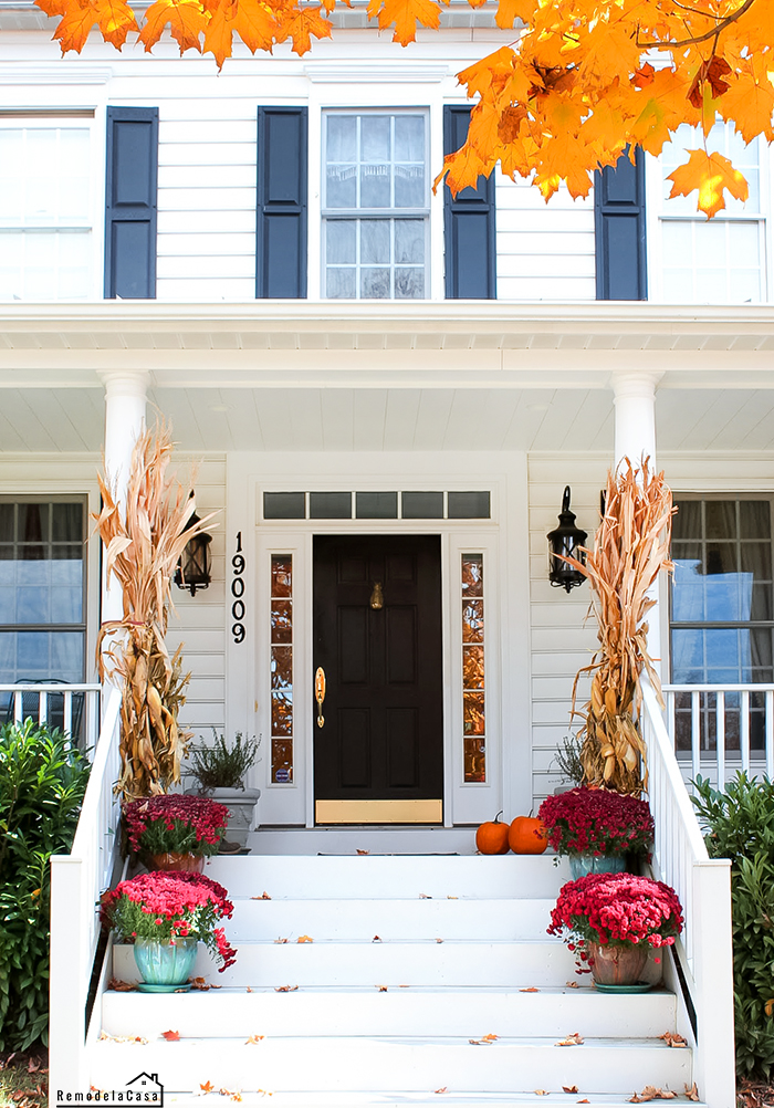 Colonial home front porch decorated for Fall