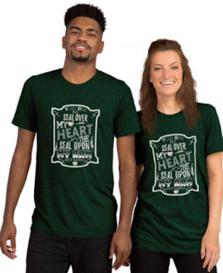 Man and Woman wearing matching Emerald Green T-Shirts with white lettering:You are a seal upon my heart a seal upon my arm.