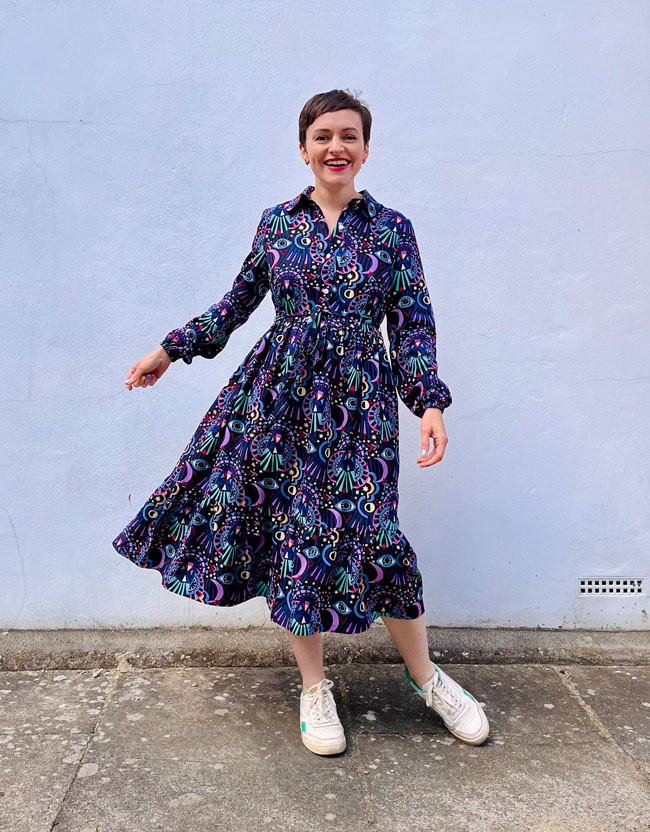 Tilly wearing midi-length long sleeved shirt dress