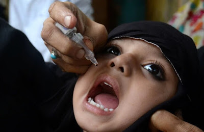 A child gets polio drops in Lahore, Pakistan