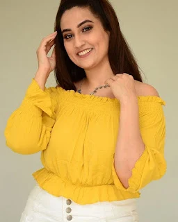 Most Beautiful Telugu Anchor Manjusha hot in yellow open neck T-shirt and white tight jeans