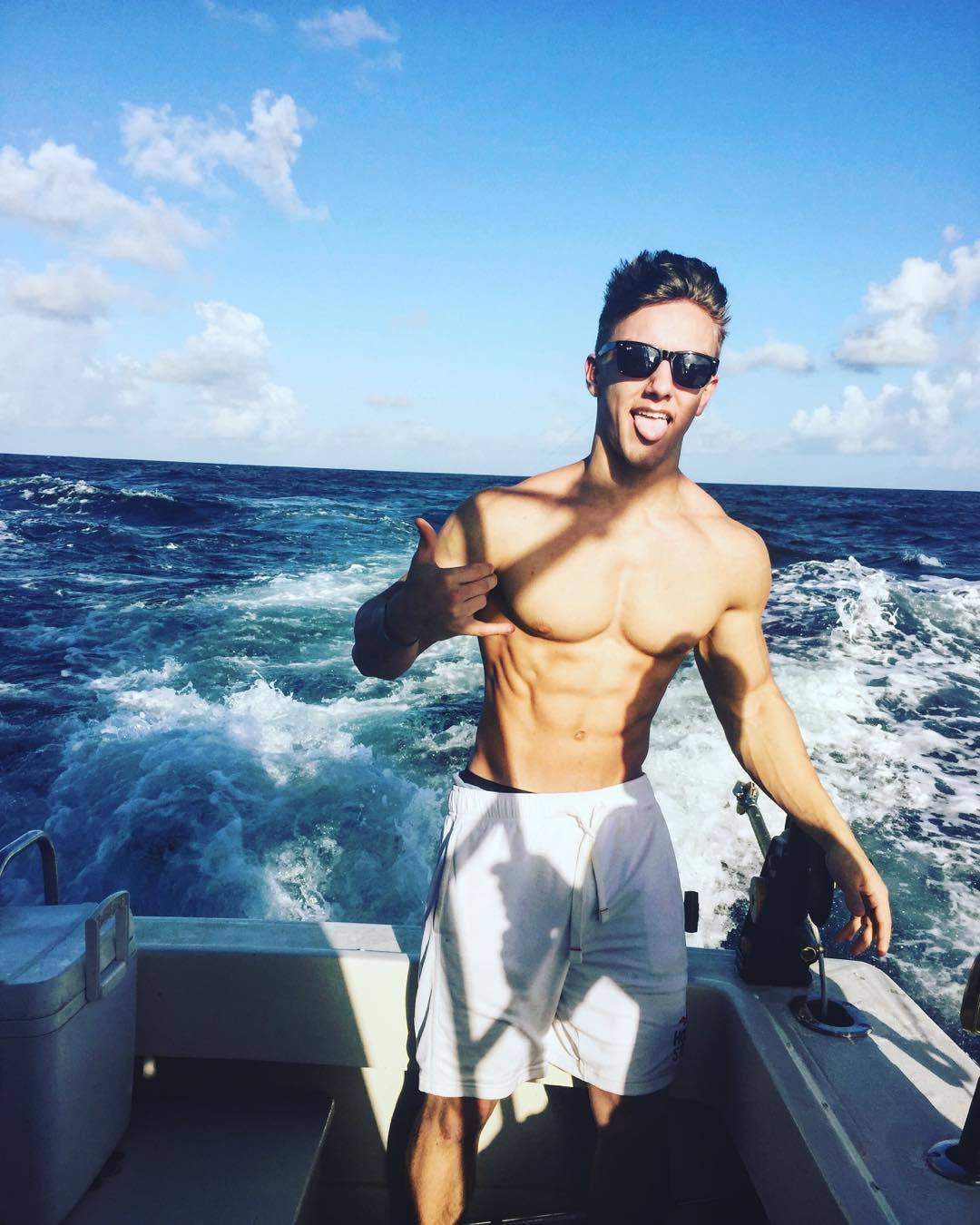 hot-men-wearing-sunglasses-cocky-bro-fit-shirtless-body-boat-ride