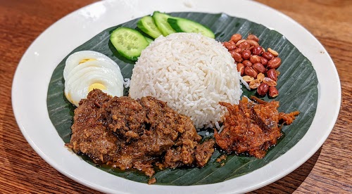 Nasi lemak with rendang curry beef
