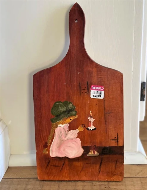 Photo of a Betsey Clark inspired cutting board from Goodwill.