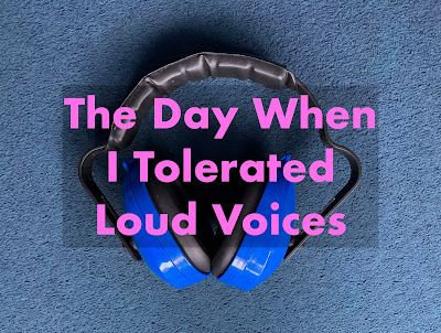 A pair of blue ear defenders, with a text overlay in pink letters, which says, "The Day When I Tolerated Loud Voices".