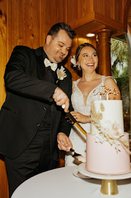 bride and groom cutting cake