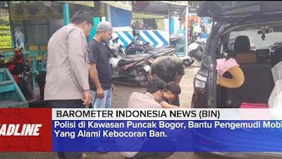 Polisi di Kawasan Puncak Bogor, Bantu Pengemudi Mobil Yang Alami Kebocoran Ban.