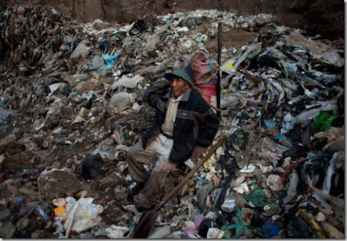 Worker in the Guatemala City trash dump taking a break