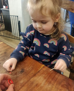 Rosie helps build the model with toothpick